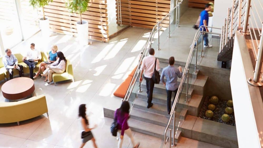 Reception Area Of Modern Office Building With People Reception Area Of Modern Office Building With People In Smart/Casual Dresswear